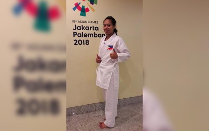 <p><strong>EARLY EXIT.</strong> Mae Soriano loses to Macau's Sok I Wong, 1-3, in the first round of the women's -55kg category in the 18th Asian Games karate competition at the Jakarta Convention Center Plenary Hall in Indonesia on Sunday. <em>(Photo by Judith Caringal/Radyo Pilipinas2)</em></p>