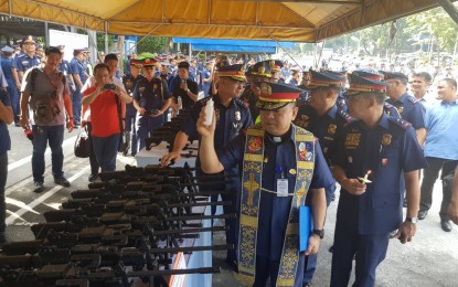 <p><strong>NEW FIREARMS. </strong>Top officials of the Philippine National Police (PNP) led by Director General Oscar Albayalde lead the inspection and blessing of more than 17,000 firearms procured through the PNP's  Capacility Enhancement Program in Camp Crame on Wednesday (Aug. 29, 2018). <em>(PNA photo by Benjamin Pulta)</em></p>