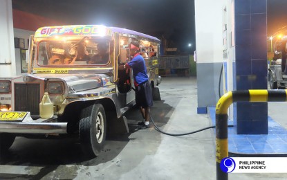 <p><strong>OLD JEEPNEYS TO STAY, FOR NOW.</strong> A traditional public utility jeepney at a gasoline-refilling station. The DOTr clarified that old public utility vehicles would still be allowed to operate beyond June 2020 following certain conditions such as passing a roadworthiness test and consolidation of individual operators into cooperatives or corporations. <em>(File photo)</em></p>