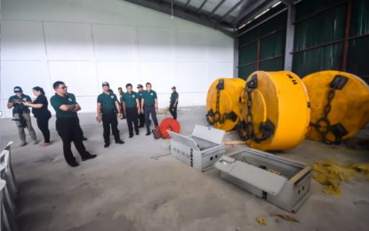 <p>Philippine Drug Enforcement Agency chief Aaron Aquino leads the inspection of four magnetic lifters recovered by PDEA at a warehouse in Cavite. <em>(Photo courtesy of PDEA)</em></p>
<p><em> </em></p>