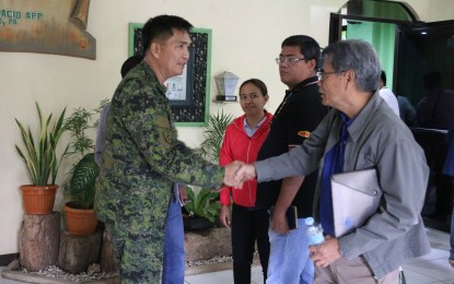 <p><strong>PROJECT MONITORING.</strong> Philippine Army 8th Infantry Division Commander Major Gen. Raul Farnacio greets National Economic and Development Authority Regional Director and Regional Project Monitoring Committee  Chairman Bonifacio Uy before the start of a recent project problem-solving session. <em>(Photo courtesy of the Philippine Army)</em></p>