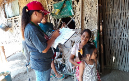<p><strong>CASH ASSISTANCE</strong>. A Department of Social Welfare and Development field personnel interviews a beneficiary of the Unconditional Cash Transfer program in a remote village in Region 1. <em>(Photo courtesy of DSWD Regional Field Office 1)</em></p>