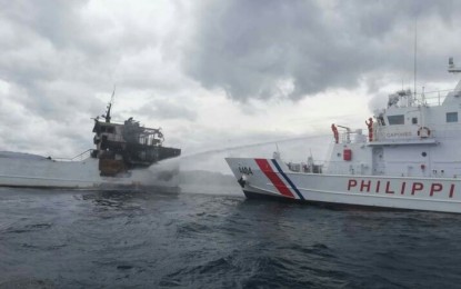 <p><strong>FERRY FIRE.</strong> Initial report revealed the fire emerged from MV Lite Ferry 28’s engine room at 11:45 a.m., while it was about to dock at the Port of Taloot in Argao, Cebu. <em>(Photo courtesy of MARINA)</em></p>