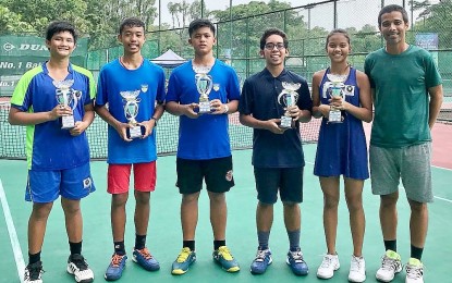 <p><strong>PROUD PINOYS.</strong> The players with their trophies after the awarding ceremony on Saturday.  (L-R) John David Velez, Rupert Ohrelle Tortal, Brent Signmond Cortes, Rainier Angelo Selmar and coach Roland Kraut.<em> (Contributed photo)</em></p>