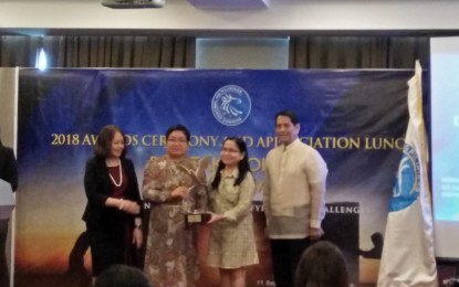 <p style="text-align: left;"><strong>BEST PARTNER.  </strong>Department of Tourism Regional Director Helen J. Catalbas  (second from left) receives  the award as regional outstanding partner of the Bangko Sentral ng Pilipinas for report on regional economic developments in the Philippines during the 2018 Awards and Appreciation Ceremony held in Iloilo City, Tuesday (September 11, 2018.) <em>(Photo by Perla Lena) </em></p>