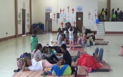 <p>Flood-hit residents caused by typhoon Ompong temporarily stay in an evacuation center  in Orani, Bataan. <em>(Photo by Ernie Esconde)</em></p>