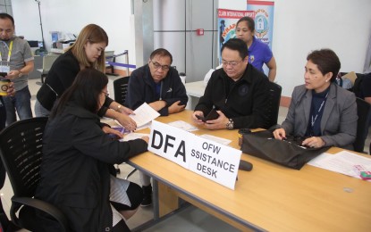 <p style="text-align: left;"><strong>AID TO STRANDED OFWs. </strong>DFA Assistant Secretary Elmer Cato supervises the DFA Assistance Desk set up at the Clark International Airport. Also in photo was  Clark International Airport Corp. president Alex Cauguiran.<em><strong> (Photo courtesy of CIAC Corporate Communications Office)</strong></em></p>