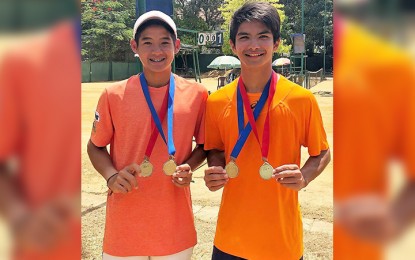 <p><strong>BACK-TO-BACK CHAMPIONS.</strong> Filipino Matthew Anton Garcia (right) and Thai Tanapatt Nirundorn show the medals they won at the Sri Lanka International Tennis Federation (ITF) Circuit in Colombo City. <em>(Contributed photo) </em></p>