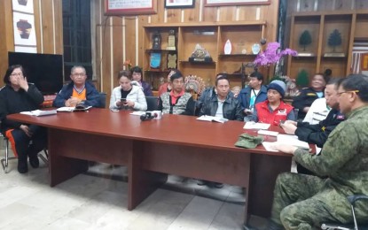 <p><strong>OMPONG'S ONSLAUGHT.</strong> Regional Development Council and Peace and Order Council chairman, Baguio Mayor Mauricio Domogan (3rd from left), presides over the coordination meeting and press briefing on the impact of Typhoon Ompong, at the Baguio City Mayor's Office on Sunday (Sept. 16, 2018). Also in the photo are (left to right): CDRRMC chairman Ruben Carandang, Communications Assistant Secretary Ana Marie Banaag; DILG-CAR Regional Director Marlo Irigan; DSWD-CAR Regional Director Janet Armas; PROCOR Director Rolando Nana; and Army’s 503rd Brigade Commander, Brig. Gen. Leopoldo Imbang. <em>(PNA photo by Liza T. Agoot)</em></p>