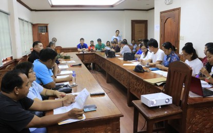 <p><strong>DEALING WITH OMPONG'S AFTERMATH. </strong>Members of the Aurora Provincial Disaster Risk Reduction and Management Council hold a meeting  to assess the extent of damages brought by typhoon Ompong. <em><strong>(Photo by Jason de Asis)</strong></em></p>