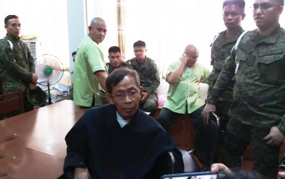 <p><strong>GUILTY.</strong> Retired Army Major General Jovito Palparan talks to newsmen inside the Regional Trial Court in the City of Malolos, Bulacan before the "guilty" verdict is handed down by the judge on kidnapping and serious illegal detention charges. (<em>Photo by Manny Balbin )</em></p>