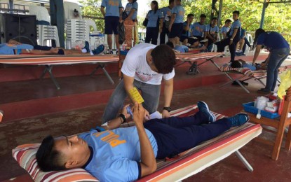 <p>DUGONG PULIS. A policeman from Manaoag town donates blood on Tuesday as part of the National Consciousness Month. <em>(Photo courtesy of Manaoag Police Station) </em></p>