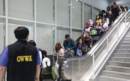<p><strong>REPATRIATED OFWS. </strong>The 108 repatriated overseas Filipino workers from Dubai arrive via flight PR 659 at the Ninoy Aquino International Airport (NAIA) Terminal 2 in Pasay City on Wednesday  (September 19, 2018.) <em>(PNA photo by Avito C. Dalan)</em></p>