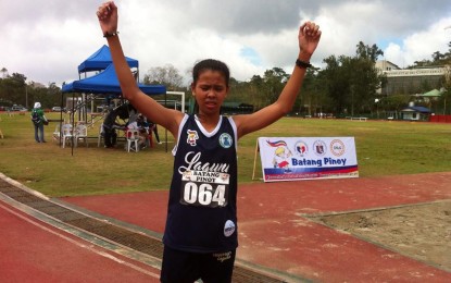 <p><strong>LAGUNA'S PRIDE.</strong> Laguna province's Magvrylle Matchino raises her hands in victory, minutes after winning the gold in the 3,000-meter steeplechase girls’ secondary category competition on Wednesday (Sept. 19, 2018) at the 2018 Batang Pinoy National Championships being held at the Baguio City Athletic Bowl. <em>(PNA Photo by Primo Agatep)</em></p>