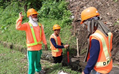 <p>DPWH Southern Leyte workers declog drainages in preparation for rainy days. <em>(Photo courtesy of DPWH)</em></p>