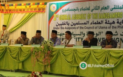 <p><strong>ULAMA SUPPORT.</strong> Moro Islamic Liberation Front chair Al Haj Murad (fourth from right) attends the 2nd Bangsamoro General Assembly of the Ulama held Tuesday (Sept. 18, 2018) at Alnor Convention Center in Cotabato City. The 1,000-strong Ulama group has signified its full support to the Bangsamoro Organic Law that would pave the way for the creation of the MILF-led Bangsamoro Autonomous Region in Muslim Mindanao replacing the old Autonomous Region in Muslim Mindanao set up. <em><strong>(Photo courtesy of the MILF Media Group)</strong></em></p>