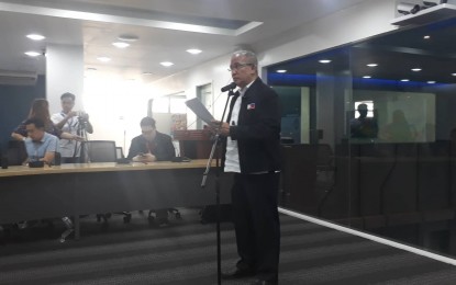 <p>NDRRMC spokesperson Edgar Posadas gives an update on the onslaught of Typhoon Ompong on Tuesday (Sept. 18, 2018). <em>(PNA photo by Priam F. Nepomuceno)</em></p>