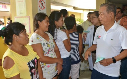 <p>Governor Alfredo Marañon Jr. (right) meets with indigent patients at the Teresita L. Jalandoni Provincial Hospital in Silay City during the inauguration of the Negros Occidental Comprehensive Health Program satellite office at the hospital on Tuesday. <em>(Photo courtesy of Negros Occidental Capitol PIO)</em></p>