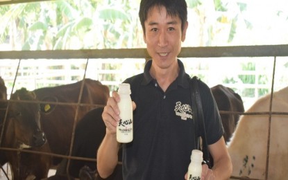 <p>Tenshinzan (Philippines) Inc. director Takahiro Ishii shows the milk produced through the Dairy Development Project at the Negros First Ranch in Barangay Sta. Rosa, Murcia, Negros Occidental. <em>(Contributed Photo)</em></p>
<p><em> </em></p>
