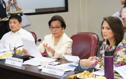 <p>Speaker Gloria Macapagal-Arroyo attends a Committee on Ways and Means Hearing on the unnumbered substitute bill to House Bills 422 and 7994 entitled "An Act Establishing the Fiscal Regime for Mining Industry." <em>(Photo courtesy of the Speaker's Office)</em></p>