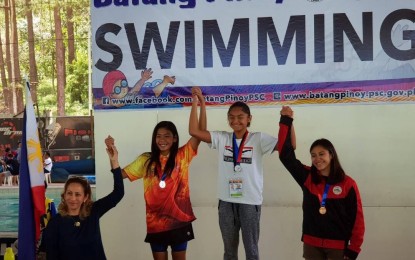 <p><strong>GETTING READY.</strong> Philippine Swimming Inc. (PSI) President Lani Velasco (left), shown here during the awarding ceremony of the Batang Pinoy National Finals in Baguio City, said the qualifying tournaments for the 2019 SEA Age Group Championships will have participants from all over the country. <em>(Contributed photo)</em></p>