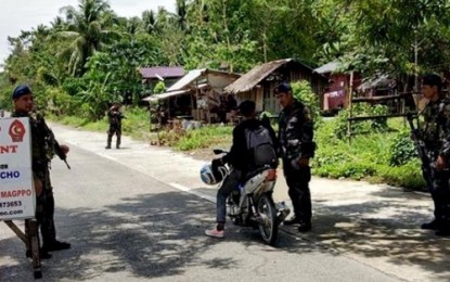 <p><strong>CHECKPOINT.</strong> A motorist undergoes inspectio in one of the checkpoints set up in Maguindanao following the series of recent bombing incidents perpetrated by suspected members of the Islamic State-linked Bangsamoro Islamic Freedom Fighters in Central Mindanao. <em><strong>(Photo by Maguindanao PPO)</strong></em></p>