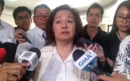 <p>Speaker Gloria Macapagal-Arroyo answers questions from the media about the marathon budget deliberations of the House of Representatives. <em>(Photo by Filane Mikee Cervantes)</em></p>