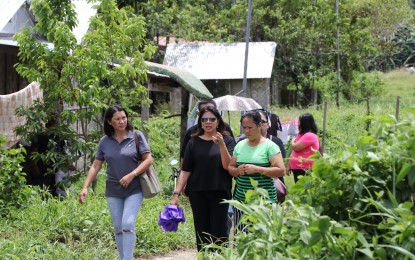 <p><strong>HOUSING SITE VISIT.</strong> Presidential Communications Operations Office Undersecretary Lorraine Marie Badoy (center) on Friday (September 21, 2018) visits Brigham Estate, a housing site in Bacagay village in Tacloban City, funded through community mortgage program of the Social Housing Finance Corp.<em> (Photo courtesy of PIA Region 8) </em></p>