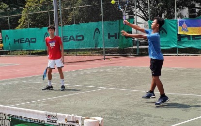 <p><strong>DOUBLES FINALISTS</strong>. Filipinos Edgardo Manuel Angara (left) and Exequiel Jucutan made it to the championship round of the boys' doubles of the PREC 14 and Under Championships in Selangor, Malaysia on Friday.<em> (Photo courtesy of Angelica Alcala)  </em></p>