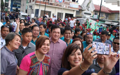 <p><strong>BAKOOD FEST</strong>. Bacoor City Mayor Lani Mercado-Revilla and Cavite lawmaker Strike Revilla takes a 'groufie' with guest, Presidential Daughter and Davao City Mayor Inday Sara Duterte, during the city’s “Bakood Festival” and 347th Founding Anniversary, which featured the local brass brands in a marching-musical spectacular parade on Sept. 28, 2018. <em>(Photo courtesy of Bacoor City Mayor’s Office)</em></p>