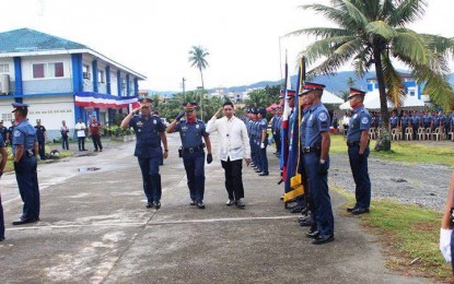 <p><strong>117<sup>th </sup>POLICE SERVICE ANNIVERSARY CELEBRATION.</strong> Dangerous Drugs Board Executive Director, Undersecretary  Earl P. Saavedra (center), is welcomed by Senior Supt. Jonas T. Amparo, Aurora Police Provincial Director and Supt. Dennis C. Wenceslao, Force Commander of Aurora 1st Mobile Force company, during the 117<sup>th </sup>Police Service Anniversary celebration held at APPO National Headquarters in Camp Victor Ravina in Baler, Aurora, Oct. 1, 2018. <em>(Photo by Jason de Asis)</em></p>