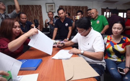 <p>Davao del Norte Second District Representative Antonio "Tonyboy" Floirendo files his Certificate of Candidacy at the Comelec in Tagum City on Thursday. <em><strong>Photo courtesy of Lean Daval</strong></em></p>