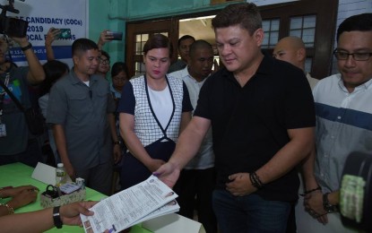 <p>Presidential son Paolo Duterte files his Certificate of Candidacy (COC) on Friday. He was accompanies by his sister Mayor Sara Duterte and brother-in-law Lawyer Manases Carpio. <em><strong>Photo courtesy of the City Information Office</strong></em></p>