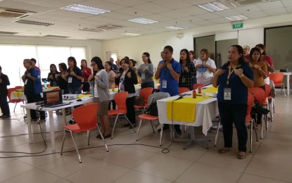 <p>Personnel of frontline offices at the lloilo City Hall train on basic sign language. <em>(Photo by Iloilo City HRMO)</em></p>