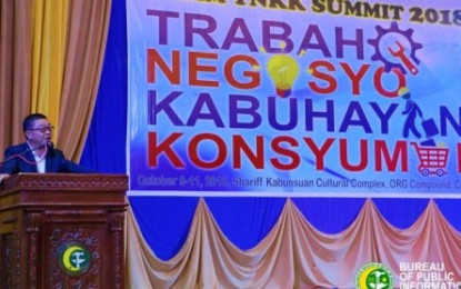 <p><strong>TNNK SUMMIT.</strong> One of the many resource speakers takes the rostrum of the Oct. 9-11 Trabaho Negosyo Kabuhayan Konsyumer (TNKK) summit held in Cotabato City. The conference focuses on smart and proper investment of money. <em><strong>(Photo by BPI-ARMM)</strong></em></p>