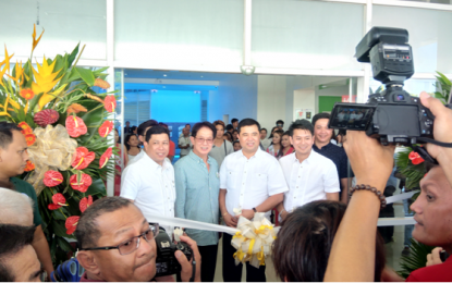 <p><strong>SOFT LAUNCH OF IMUS CITY HOSPITAL.</strong> Cavite 3<sup>rd</sup> District Representative Alex L. Advincula (center), Imus City Mayor Emmanuel L. Maliksi (right) and Vice Mayor Arnel M. Cantimbuhan (leftmost) with DOH Region IV-A (Calabarzon) Director Dr. Eduardo C. Janairo, lead the ceremonial ribbon cutting to formally launch the ‘Ospital ng Imus’ on Fri, Oct 12.  The PHP300-million Level 1 city government-run hospital, headed by Dr. Edgardo Figueroa, chief of hospital, offers major and minor operating facilities and other ancillary services such as laboratory, x-ray, and ultrasound.<em> <strong>(Photo by Gladys S. Pino)</strong></em></p>