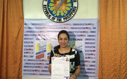 <p>Former Health Secretary Janette Garin poses for a photo holding her certificate of candidacy which she filed at the Comelec office in Iloilo on Wednesday (October 17, 2018).  <em>(File photo) </em></p>