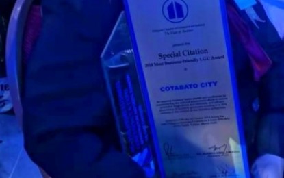<p><strong>ACKNOWLEDGED.</strong> The special citation received by Cotabato City during the 2018 Philippine Chamber of Commerce and Industry awarding ceremony held at Manila Hotel last Thursday (Oct. 18, 2018). The city was also cited as one of the ten most business-friendly cities for this year. <em><strong>(Photo by Cotabato CIO)</strong></em></p>