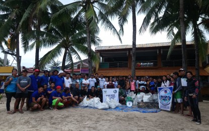 <p><strong>CLEANUP TEAM.</strong> Members of Boracay Business Administration of Scuba Shops (BBASS)  and other water sports association in Boracay after the conduct of the underwater cleanup and collection of crown of thorns. <em>(Photo by Karen Bermejo)</em> </p>
