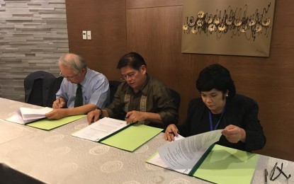 <p>National Science and Technology Center for Disaster Reduction of Taiwan director Dr. Hongey Chen, Iloilo City Mayor Jose Espinosa (center) and Maria Antonia Loyzaga of the National Resilience Council sign the Memorandum of Cooperation for the implementation of the integrated risk assessment platform in Iloilo City on October 18 in Metro Manila. <em>(Photo courtesy of Jessice Dator-Bercilla) </em></p>