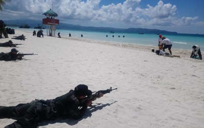 <p><strong>SIMULATION EXERCISE.</strong> Soldiers and other security forces take part in a simulation exercise of drowning incident, kidnapping scenario, bomb attack, hostage-taking, fire, and search and rescue operation held at the White Beach of this world-famed island on Thursday (October 25,2018). <em>(Photo by Karen Bermejo)</em></p>