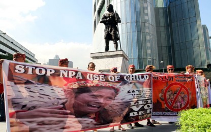 <p><strong>NO TO RECRUITMENT OF IP CHILDREN</strong>. Hundreds of indigenous People (IP) join the condemnation rally against the CPP-NPA/NDF recruitment of their youngsters for communists' and harmful activities at Sultan Kudarat Shrine in Makati City on Friday (Oct. 26, 2018). <em>(PNA photo by Joey O. Razon)</em></p>