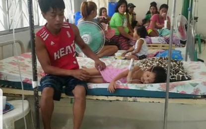 <p>Some of the victims of food poisoning while in the hospital in Guiguinto, Bulacan. <em>(Photo by Manny Balbin)</em></p>