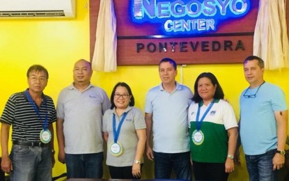 <p>DTI-Negros Occidental Provincial Director Lea Gonzales (3<sup>rd</sup> from left) and Senior Trade and Industry Development Specialist Engiemar Tupas (2<sup>nd</sup> from left) with Mayor Jose Benito Alonso (3<sup>rd</sup> from right) and Fourth District Board Member Jose Maria Alonso (right) during the opening of the Negosyo Center in Pontevedra town on Friday (October 26, 2018).<em> (Photo courtesy of DTI-Negros Occidental)</em></p>
<p><em> </em></p>
