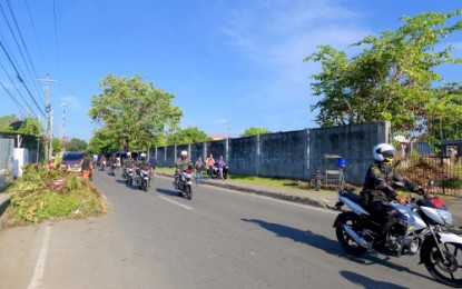 <p><strong>UNDAS PATROL.</strong> Cops on motorcycles guarding the vicinity of cemeteries during the observance of Undas in Cotabato City <em><strong>(Photo by PNA Cotabato)</strong></em></p>