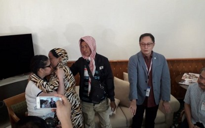 <p><strong>REUNITED.</strong> After several years of jail time in the United Arab Emirates, Overseas Foreign Worker Jennifer Dalquez (left) is finally reunited with her parents, Alicia and Abdul Hamid (2nd and 3rd from left), at the Ninoy Aquino International Airport in Pasay City on Friday (November 2, 2018). <em>(Photo by Joyce Rocamora) </em></p>