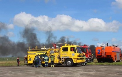 <p><strong>PROMPT RESPONSE.</strong> Fire trucks from various stations and volunteer units respond during the crash landing simulation exercise at the Bacolod-Silay Airport in Silay City, Negros Occidental held on Friday (November 9, 2018)<em>(Photo courtesy of PIA Negros Occidental) </em></p>