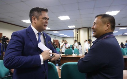 <p><strong>APPROVAL OF PCOO BUDGET</strong>.  Senator Joseph Victor Ejercito (right), Chair of the Finance (Subcommittee “F”), chats with Presidential Communications Operations Office (PCOO) Secretary Jose Ruperto Martin Marfori Andanar, after his committee tentatively approved the proposed 2019 P1.41-billion budget for the Office of the Press Secretary (OPS) that will replace the current Presidential Communications Operations Office (PCOO), after the hearing at the Senate in Pasay City on Monday (Nov. 12, 2018). The final approval of the OPS budget and its attached agencies will depend on the issuance by President Rodrigo R. Duterte of an Executive Order reverting the PCOO and its attached agencies to Office of the Press Secretary. <em>(PNA photo by Avito C. Dalan)</em></p>