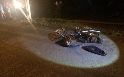 <p><strong>FALLEN.</strong> The motorcycle of slain Barangay Rosary Heights 7 Councilor Jainudin Ilah Dimao left at the pavement following his shooting dead by a riding-in-tandem around 5:30 p.m. Monday (Nov. 12, 2018) along Gonzalo Javier Street in Cotabato City. <em><strong>(Photo courtesy of Jom Dimapalao – Brigada News Cotabato)</strong></em></p>