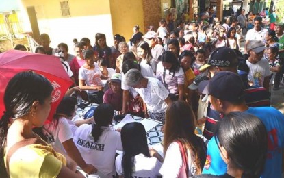 <p><strong>GOV'T AID FOR HIMAMAYLAN VILLAGERS.</strong> Residents of four remote villages in Himamaylan City, Negros Occidental avail of health and other government services during the Multi-Service Peace Caravan initiated by the provincial government on Tuesday (November 13, 2018).  <em>(Photo by Richard Malihan/Negros Occidental Capitol PIO)</em></p>